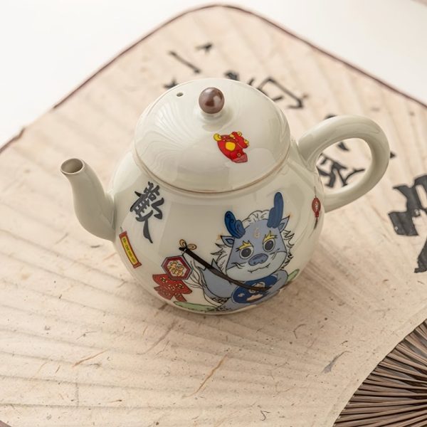 2-13-1.jpg Vintage Porcelain Pear-Shaped Dragon Teapot Featuring Cute Cartoon Dragon Pattern