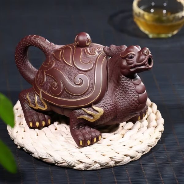 4-27.jpg Unique Gilding Dragon Turtle Shaped Teapot with Dragon Ball Twist Made from Yixing Purple Clay