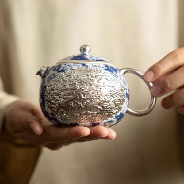 a-23.jpg Vintage Ceramic Teapot With Blue And White Relief Pattern Featuring Silver Dragon And Phoenix