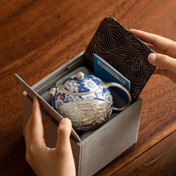 b-26.jpg Vintage Ceramic Teapot With Blue And White Relief Pattern Featuring Silver Dragon And Phoenix