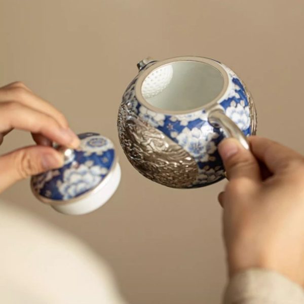 c-26.jpg Vintage Ceramic Teapot With Blue And White Relief Pattern Featuring Silver Dragon And Phoenix