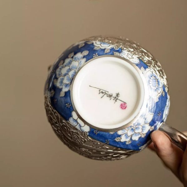 d-26.jpg Vintage Ceramic Teapot With Blue And White Relief Pattern Featuring Silver Dragon And Phoenix